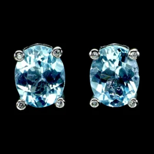 Ezüst fülbevaló topázzal, 10*8 mm, égszínkék, beszúrós kivitel